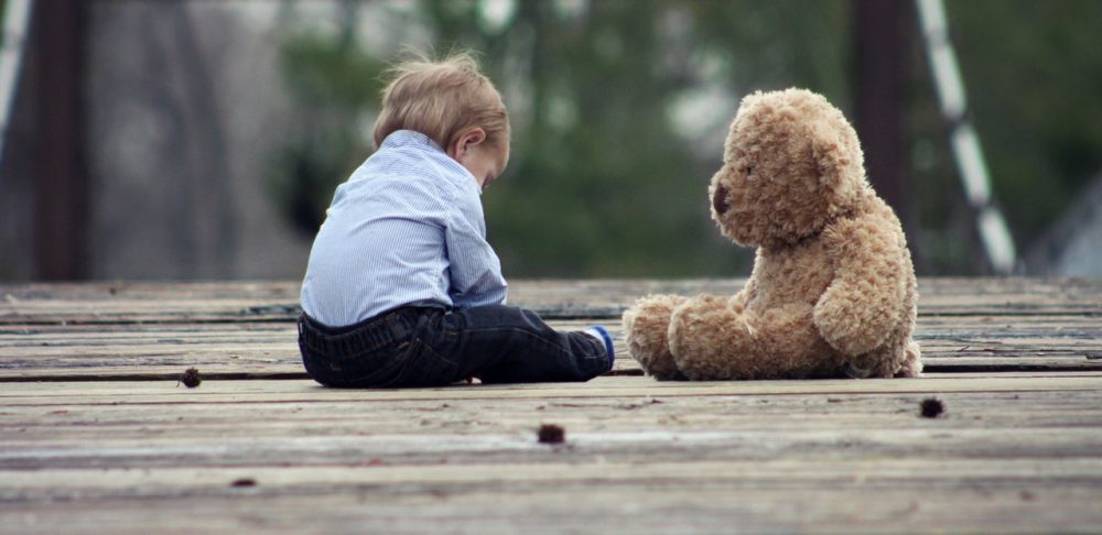 child alone with teddy bear